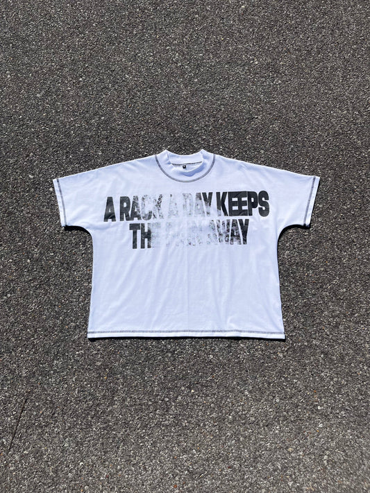 "A RACK A DAY KEEPS THE PAIN AWAY" BOXY TEE IN WHITE