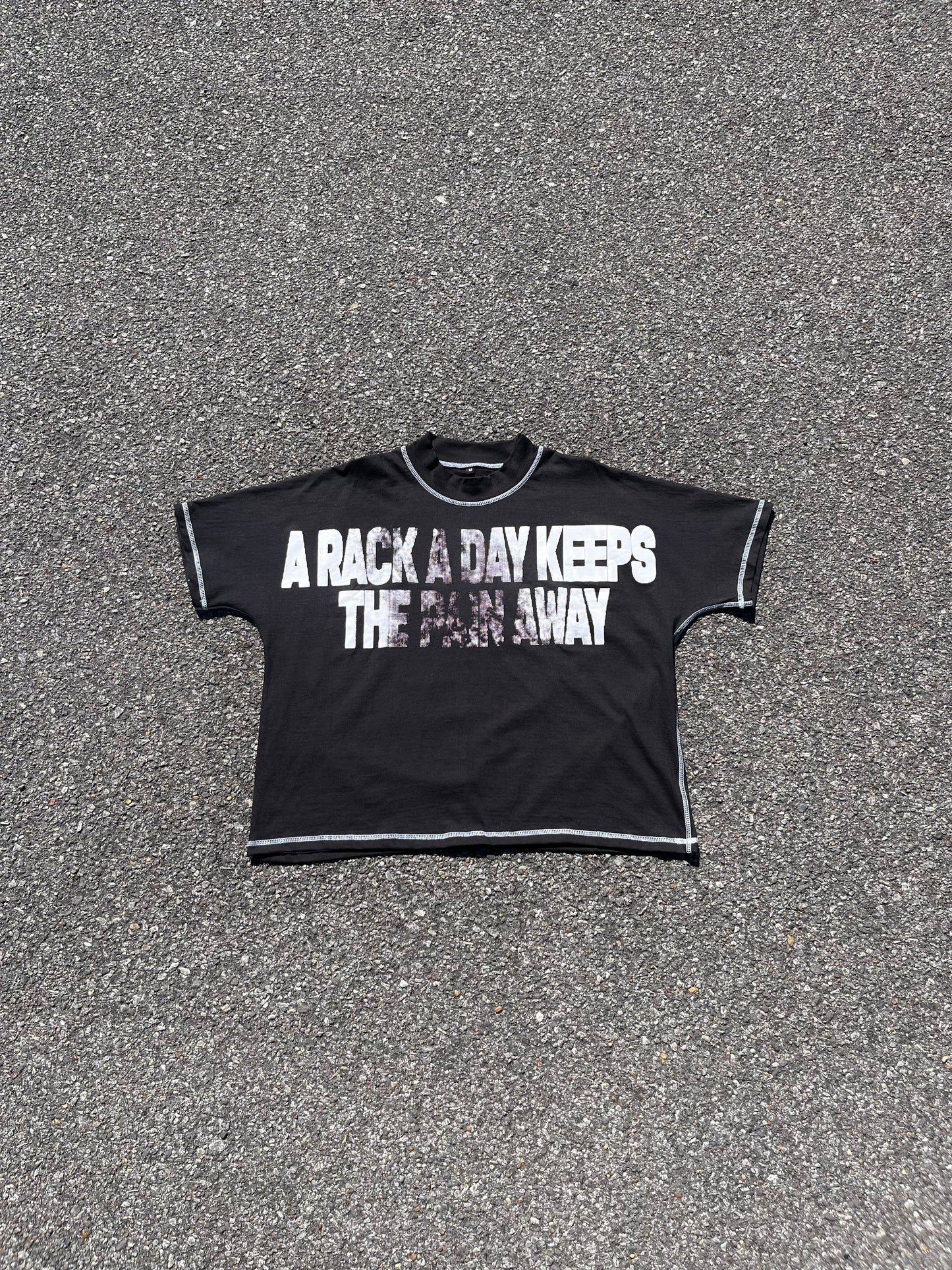 "A RACK A DAY KEEPS THE PAIN AWAY" BOXY TEE IN BLACK